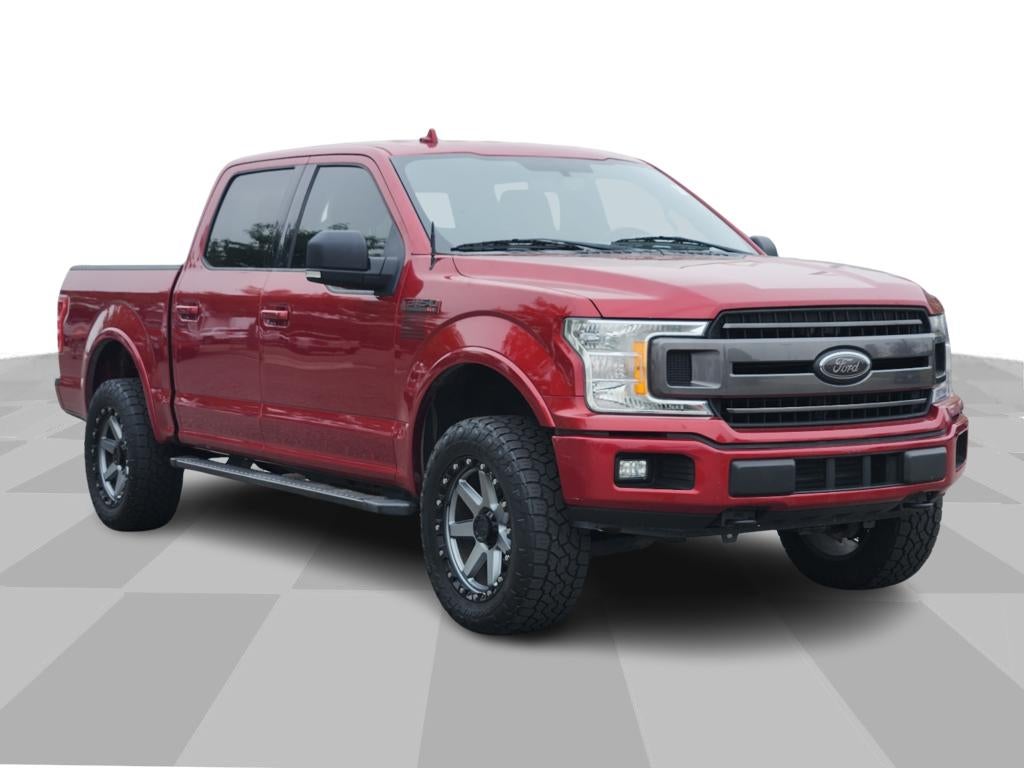 2018 Ford F-150 XLT in Ruby Red Metallic Tinted Clearcoat — front three-quarter view