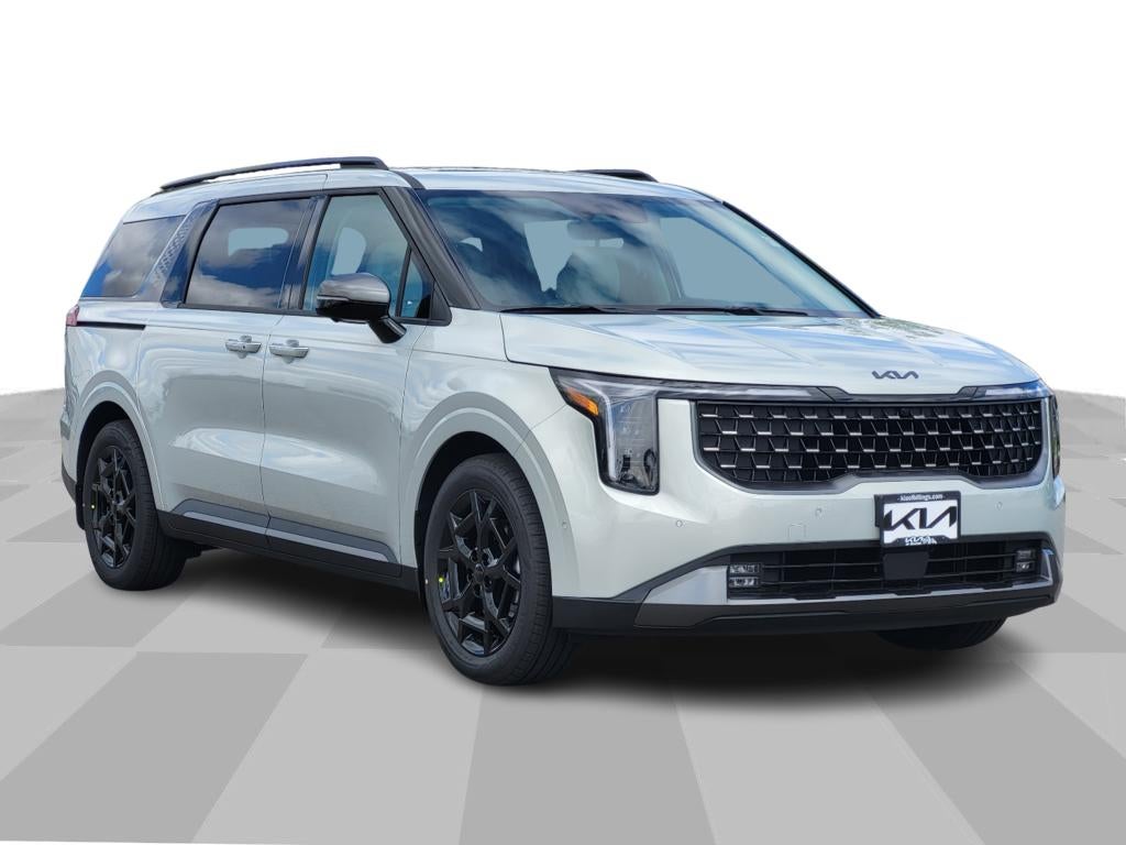 2026 Kia Carnival SX Prestige in Ivory Silver — front three-quarter view