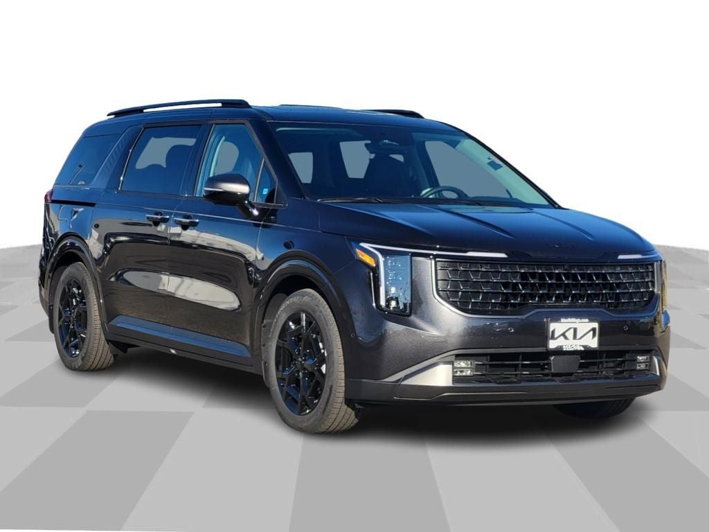 2026 Kia Carnival SX Prestige in Panthera Metal — front three-quarter view