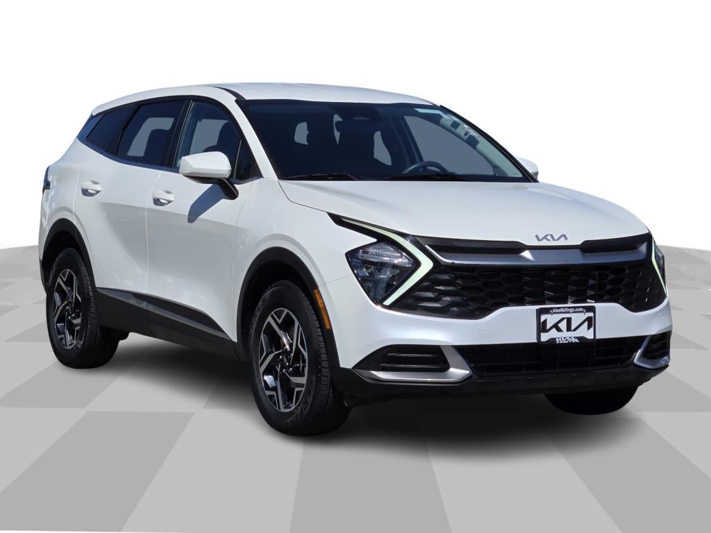 2023 Kia Sportage LX in Snow White Pearl — front three-quarter view
